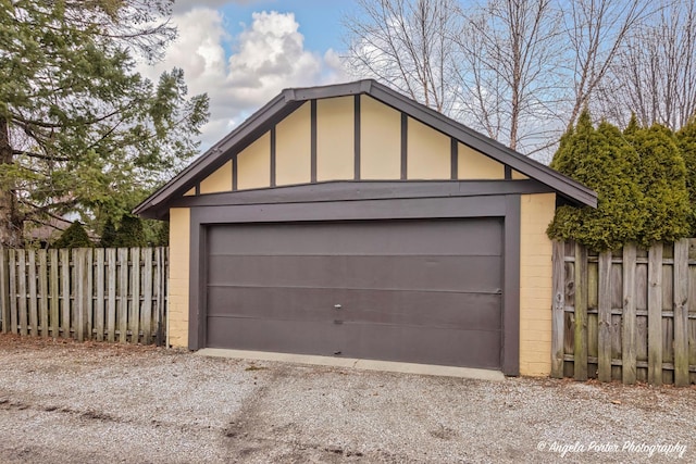 detached garage with fence