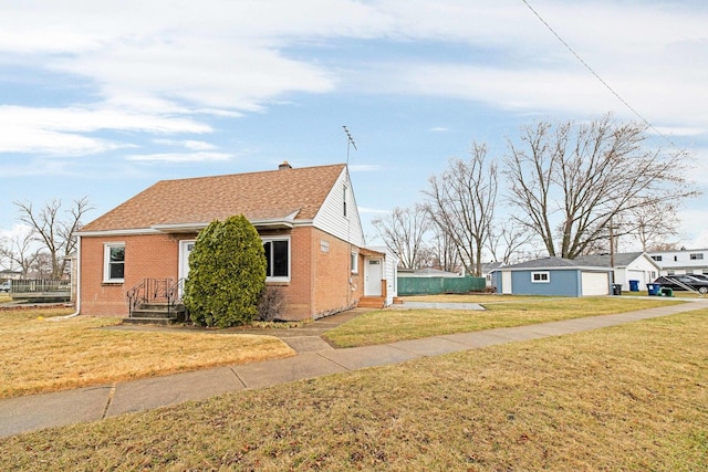 view of property exterior featuring roof with shingles, a chimney, a yard, and brick siding