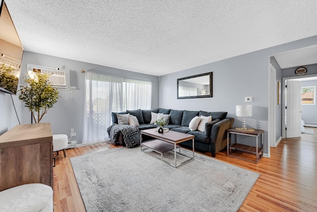 9960 Franchesca Ct Unit 2C, Orland Park, IL 60462 - living area featuring a textured ceiling, light wood-style flooring, baseboard heating, and baseboards