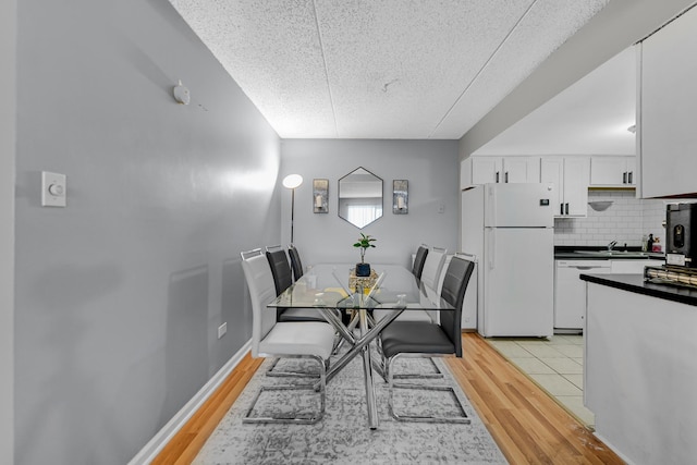 9960 Franchesca Ct Unit 2C, Orland Park, IL 60462 - dining space with a textured ceiling and light wood finished floors
