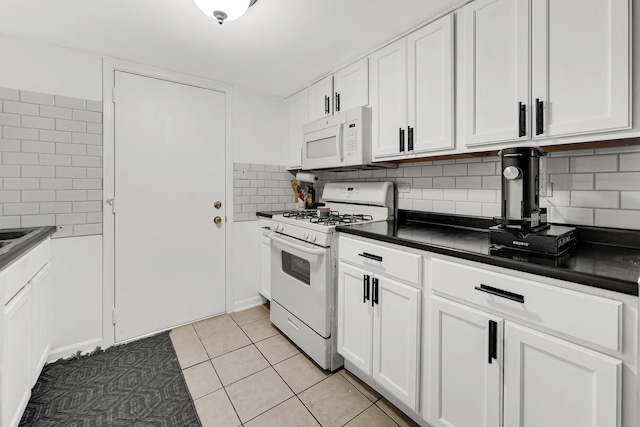 9960 Franchesca Ct Unit 2C, Orland Park, IL 60462 - kitchen with white appliances, dark countertops, white cabinets, and light tile patterned flooring