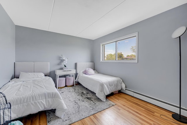 9960 Franchesca Ct Unit 2C, Orland Park, IL 60462 - bedroom with a baseboard heating unit and wood finished floors