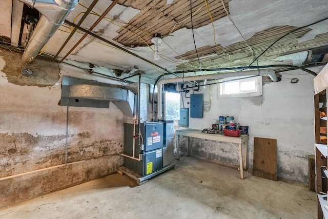 below grade area with heating unit and electric panel
