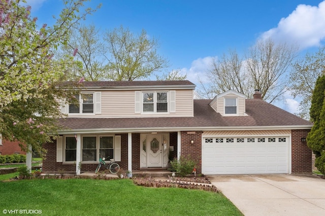 traditional home with covered porch, driveway, a chimney, a front yard, and a garage