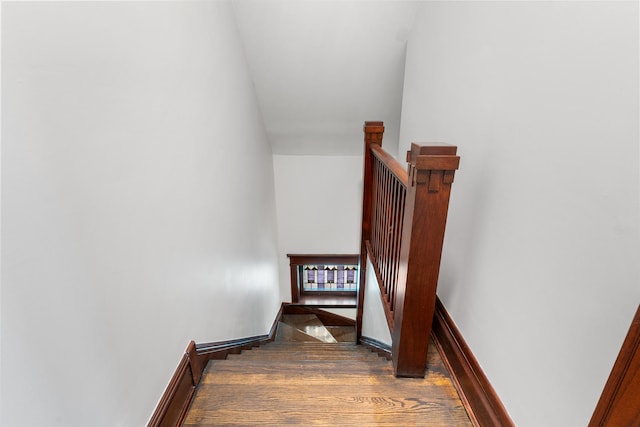 stairway with wood finished floors