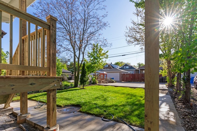 view of green lawn with a residential view