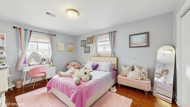 bedroom with wood finished floors