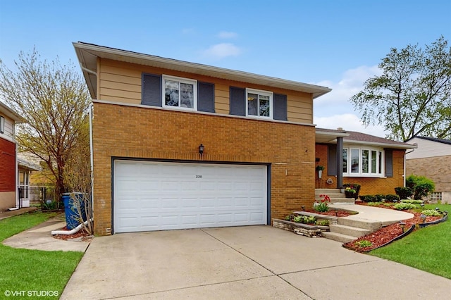 split level home featuring an attached garage, brick siding, and driveway