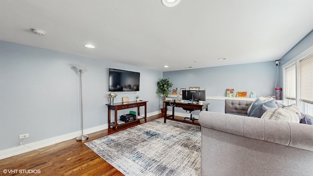 living room with wood finished floors, recessed lighting, baseboards, and an office area