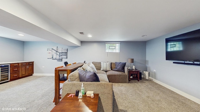 living room with wine cooler, light carpet, baseboards, and recessed lighting