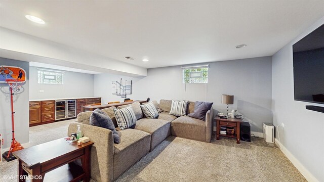 living room featuring beverage cooler, light carpet, a dry bar, recessed lighting, and baseboards