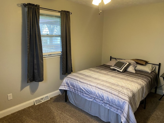 bedroom with baseboards, carpet, and visible vents