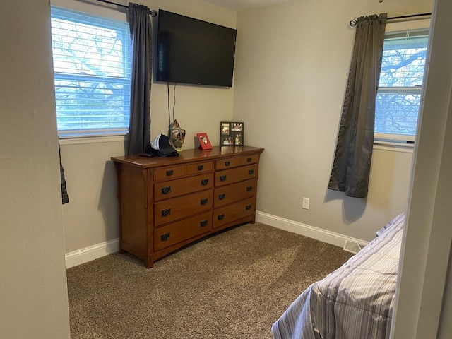 carpeted bedroom with baseboards