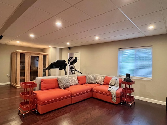 living area with baseboards, recessed lighting, and wood finished floors