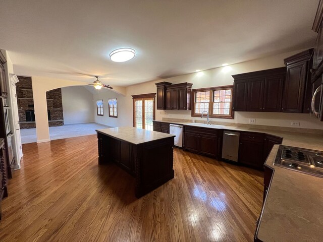 14312 Twin Creek Ct, Homer Glen, IL 60491 - kitchen with dark brown cabinetry, a ceiling fan, stainless steel dishwasher, a sink, and light countertops