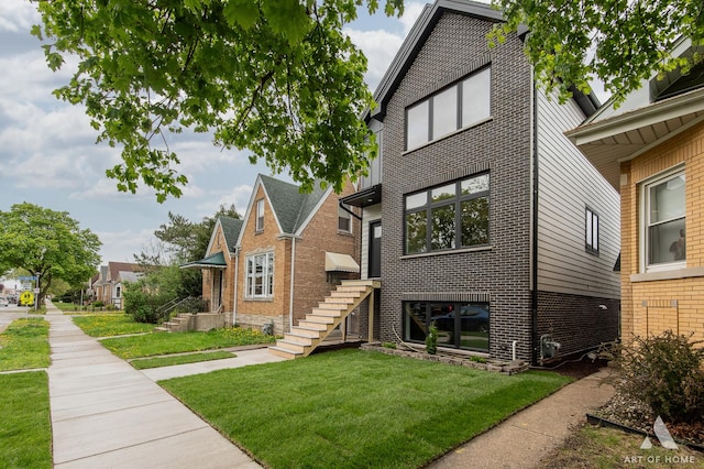 6908 26th St, Berwyn, IL 60402 - view of front of home featuring brick siding and a front yard