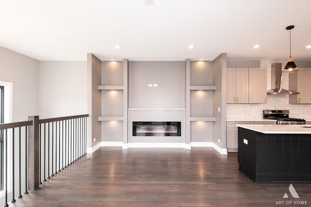 6908 26th St, Berwyn, IL 60402 - kitchen featuring decorative light fixtures, dark wood-style flooring, gas range, wall chimney exhaust hood, and light countertops