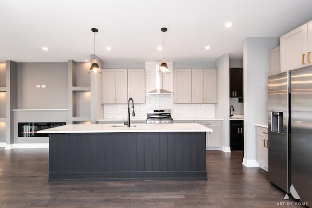 6908 26th St, Berwyn, IL 60402 - kitchen featuring light countertops, wall chimney exhaust hood, stainless steel appliances, and a sink