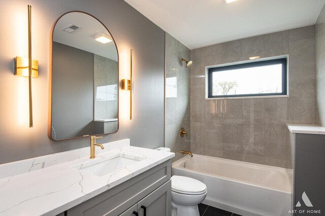 6908 26th St, Berwyn, IL 60402 - bathroom featuring toilet, vanity, visible vents, and shower / tub combination