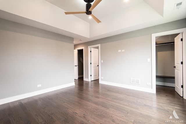6908 26th St, Berwyn, IL 60402 - unfurnished bedroom featuring visible vents, baseboards, a walk in closet, and dark wood-type flooring