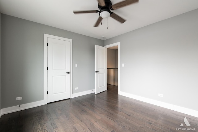 6908 26th St, Berwyn, IL 60402 - unfurnished bedroom with dark wood-style flooring, baseboards, and ceiling fan