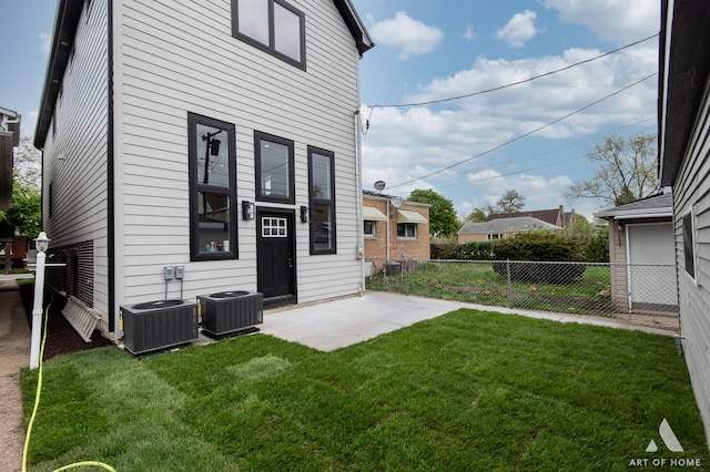 6908 26th St, Berwyn, IL 60402 - back of house with a patio area, fence, a lawn, and central AC