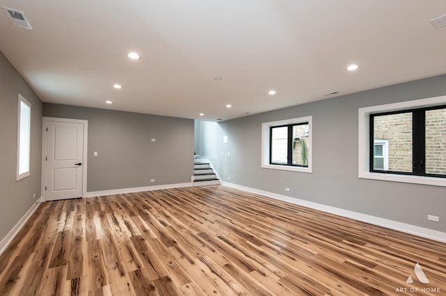 6908 26th St, Berwyn, IL 60402 - unfurnished room with light wood-type flooring, visible vents, baseboards, stairway, and recessed lighting