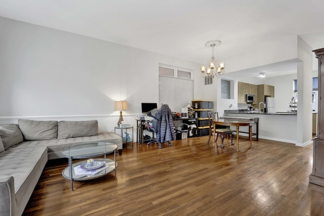 1455 S Halsted St, Chicago, IL 60607 - living room with an inviting chandelier, baseboards, and wood finished floors