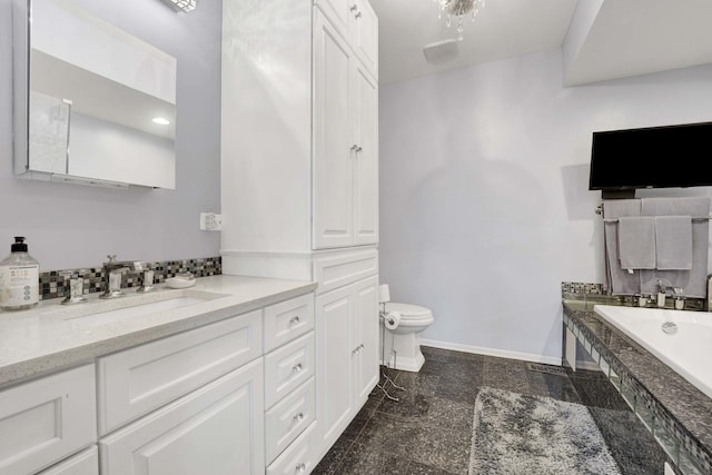 1455 S Halsted St, Chicago, IL 60607 - bathroom featuring baseboards, a garden tub, toilet, and vanity