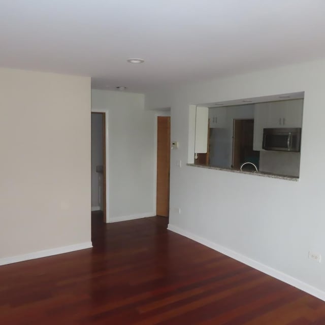 457 N Cambridge Dr Unit 457, Palatine, IL 60067 - unfurnished living room with baseboards, recessed lighting, and wood finished floors
