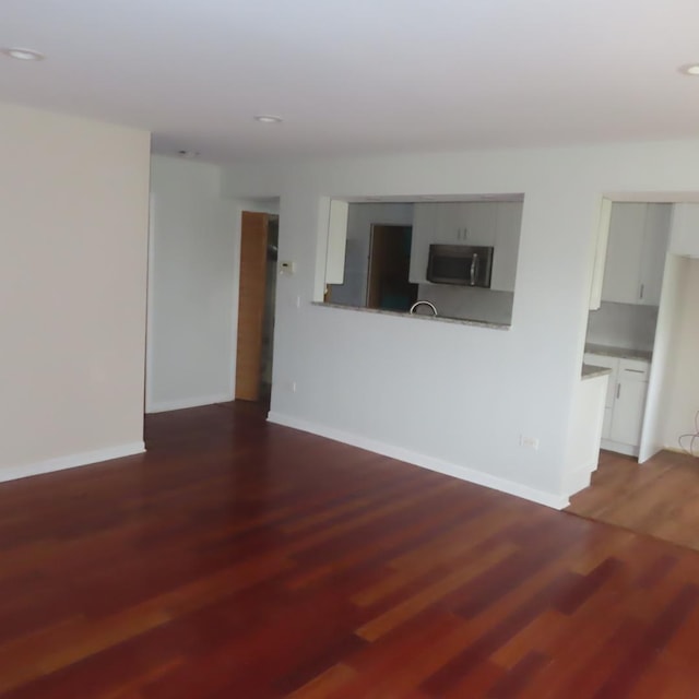 457 N Cambridge Dr Unit 457, Palatine, IL 60067 - unfurnished living room with baseboards, recessed lighting, and wood finished floors