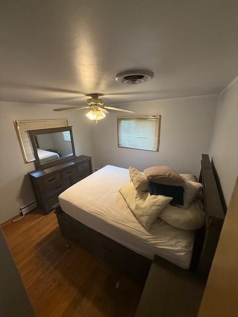 1304 Price Ave, Calumet City, IL 60409 - bedroom with visible vents, ceiling fan, and wood finished floors