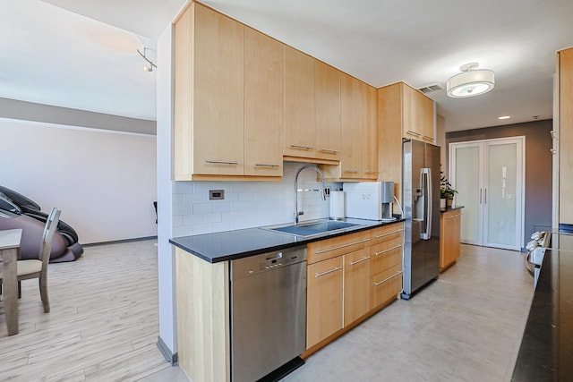 77 S Evergreen Ave Unit 1004, Arlington Heights, IL 60005 - kitchen featuring appliances with stainless steel finishes, a sink, dark countertops, and light brown cabinets