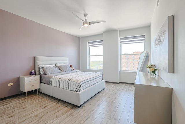 77 S Evergreen Ave Unit 1004, Arlington Heights, IL 60005 - bedroom featuring light wood-type flooring and ceiling fan