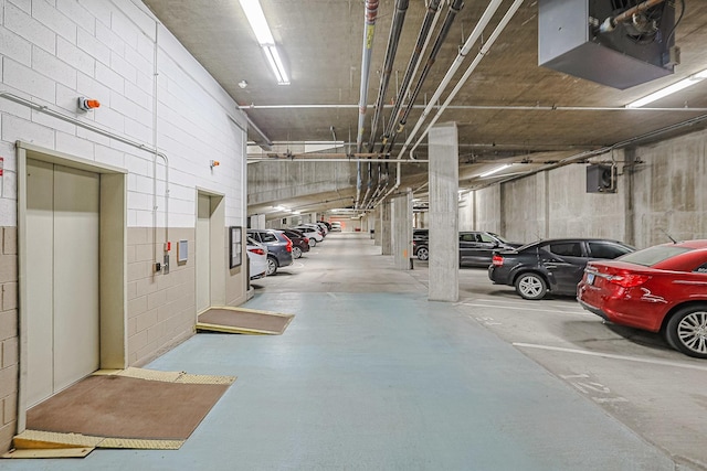 77 S Evergreen Ave Unit 1004, Arlington Heights, IL 60005 - parking deck with elevator, concrete block wall, and a garage door opener