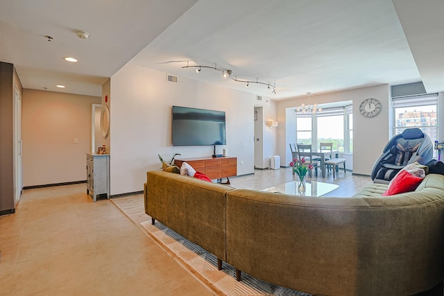 77 S Evergreen Ave Unit 1004, Arlington Heights, IL 60005 - living room featuring a chandelier, recessed lighting, and baseboards
