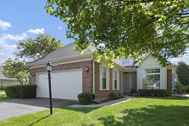 36225 N Goldspring Ct, Gurnee, IL 60031 - view of front of house with brick siding, asphalt driveway, a front lawn, an attached garage, and a shingled roof