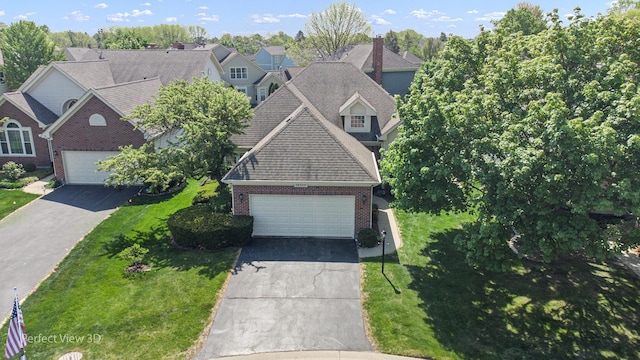 36225 N Goldspring Ct, Gurnee, IL 60031 - view of front of house with brick siding, a front lawn, a garage, and roof with shingles