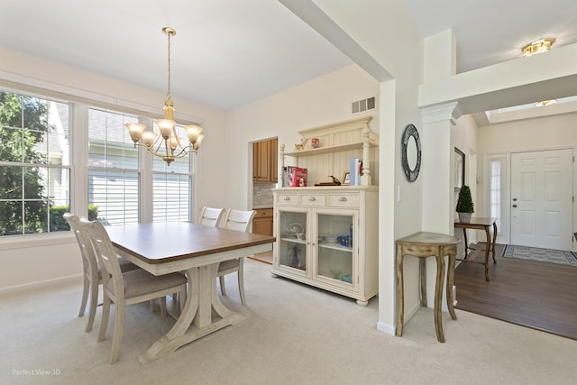 36225 N Goldspring Ct, Gurnee, IL 60031 - dining space with light carpet, a chandelier, and baseboards