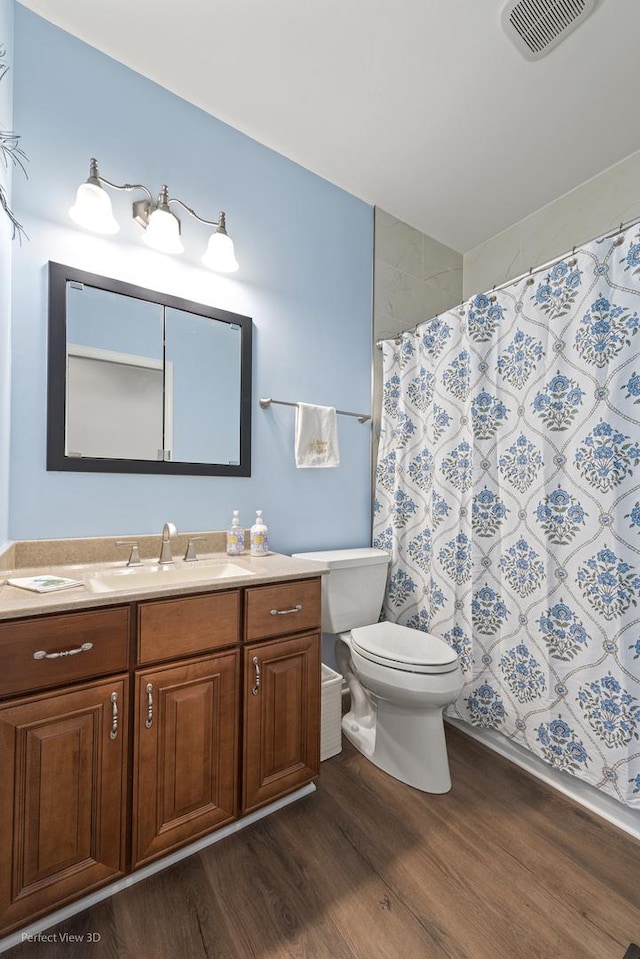 36225 N Goldspring Ct, Gurnee, IL 60031 - full bath featuring wood finished floors, vanity, toilet, and a shower with curtain