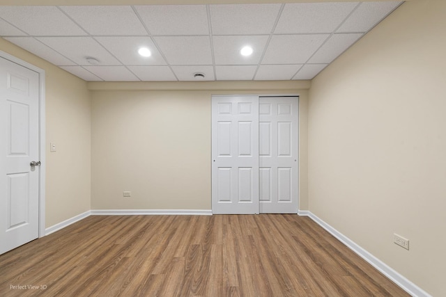 36225 N Goldspring Ct, Gurnee, IL 60031 - unfurnished bedroom featuring wood finished floors, baseboards, recessed lighting, a closet, and a drop ceiling