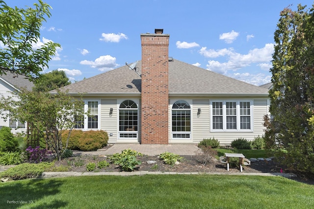 36225 N Goldspring Ct, Gurnee, IL 60031 - back of house with a patio, a shingled roof, a lawn, and a chimney