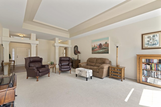 36225 N Goldspring Ct, Gurnee, IL 60031 - carpeted living room featuring decorative columns, a raised ceiling, and baseboards
