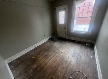 5217 S Ingleside Ave, Chicago, IL 60615 - interior space with baseboards and dark wood-type flooring