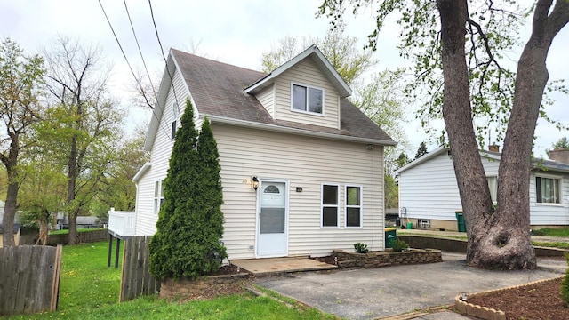 20 S Lake Ave, Fox Lake, IL 60020 - back of property with a patio and roof with shingles