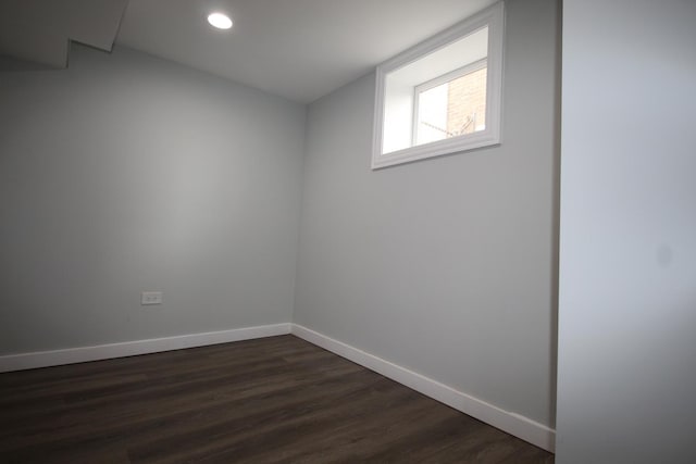 empty room with recessed lighting, baseboards, and dark wood-style flooring