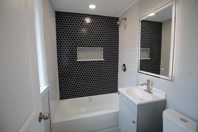 bathroom with toilet, shower / washtub combination, and vanity