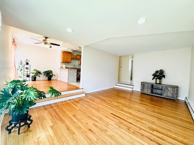 unfurnished living room with light wood-style floors, recessed lighting, baseboards, and a ceiling fan