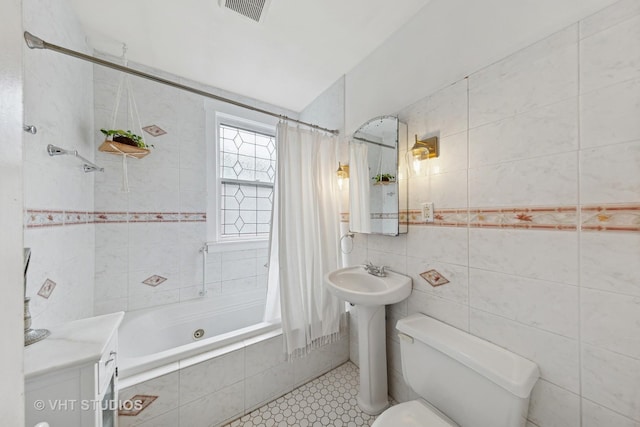 9606 S Vanderpoel Ave, Chicago, IL 60643 - full bath with tile walls, tiled shower / bath combo, toilet, tile patterned flooring, and a sink