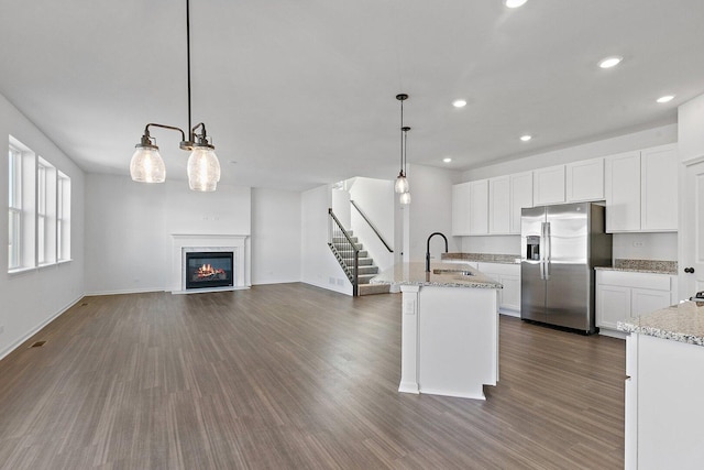32013 Savannah Dr, Lakemoor, IL 60051 - kitchen featuring dark wood-style flooring, open floor plan, stainless steel fridge, and a sink